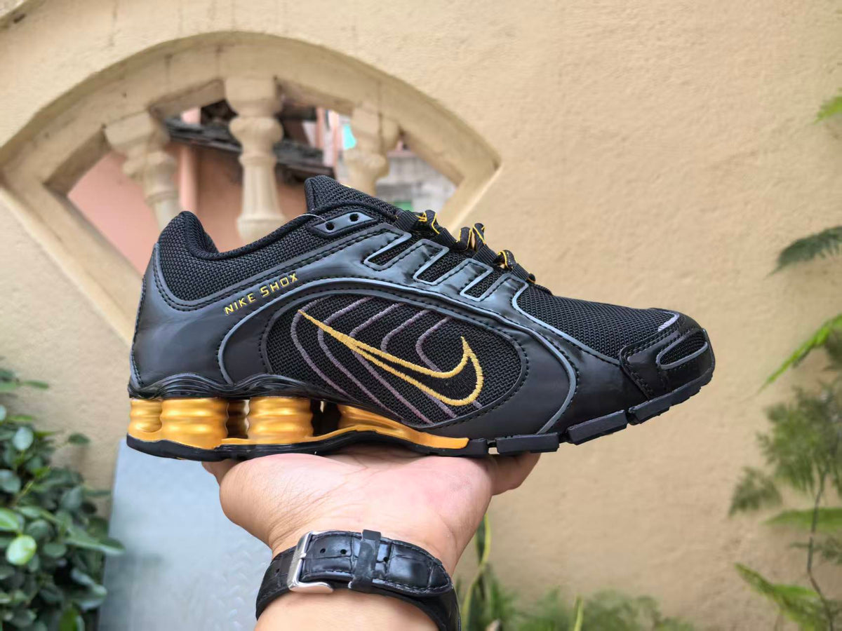 Nike Shox Black and Gold Low-Top Sneakers