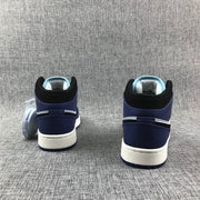 Air Jordan 1 Mid White, Black and Purple Sneakers