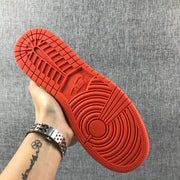Jordan Air Jordan 1 Mid GS Sneakers in Pink and Orange