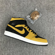 Air Jordan 1 Mid Black and Yellow Sneakers