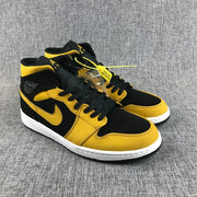 Air Jordan 1 Mid Black and Yellow Sneakers