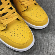Air Jordan 1 Mid University Gold Black White Sneakers