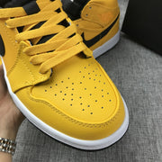 Air Jordan 1 Mid University Gold Black White Sneakers