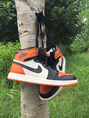 Jordan 1 High Sneakers in Black, White and Orange