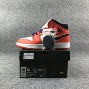 Jordan Air Jordan 1 Mid GS Sneakers in Pink and Orange