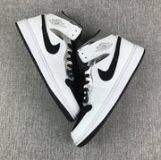 Air Jordan 1 Mid White and Black Sneakers