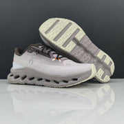 On Cloudmonster Running Shoes in Light Gray and Taupe