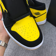Air Jordan 1 Mid Black and Yellow Sneakers